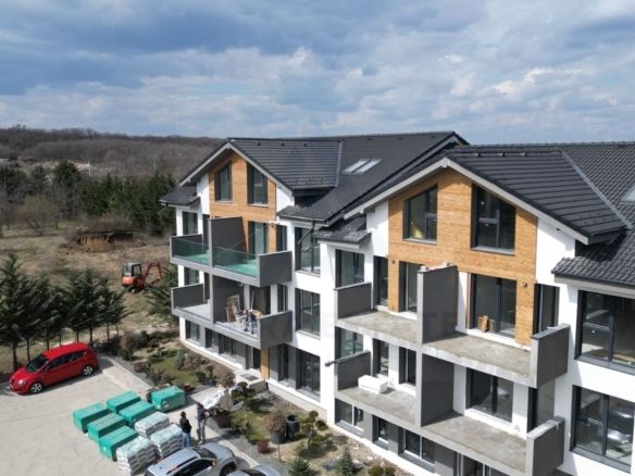 Apartament premium 61.4 mp utili 3 camere 2 bai curte 50 mp Cristian