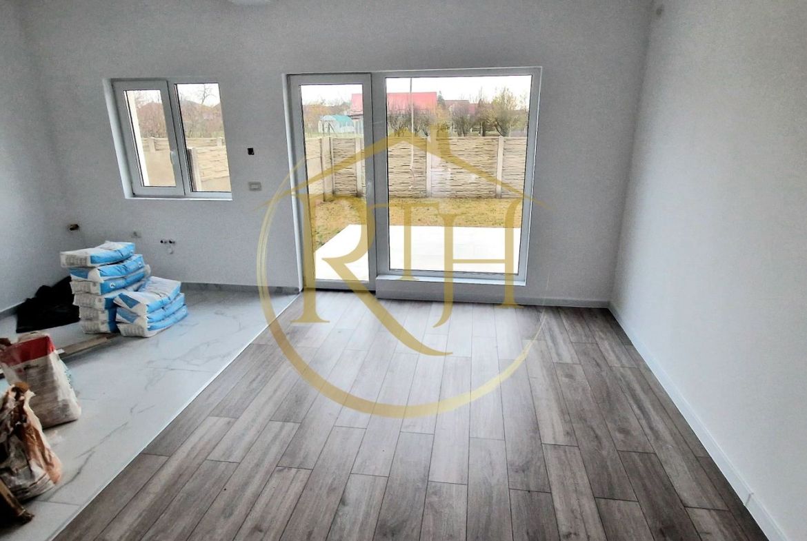 Duplex de vanzare cu 4 camere,2 bai,250 mp teren-Mosnita Veche zona Centrala.