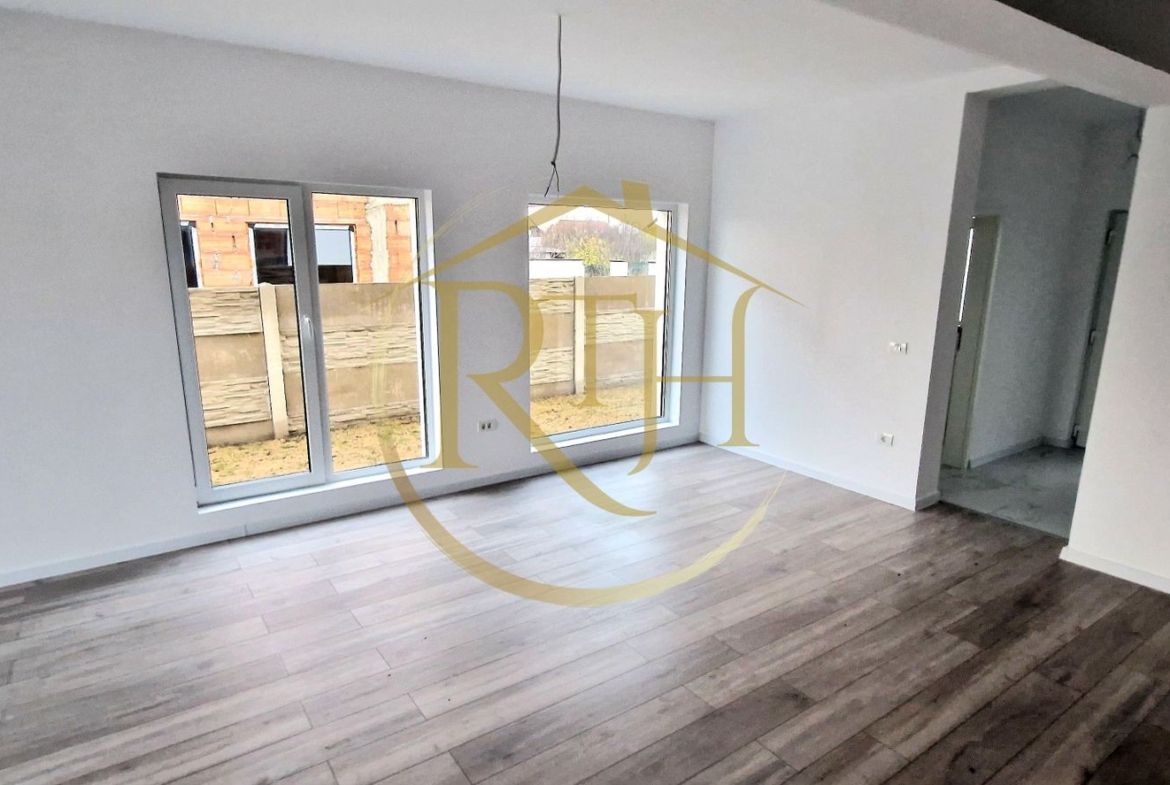 Duplex de vanzare cu 4 camere,2 bai,250 mp teren-Mosnita Veche zona Centrala.